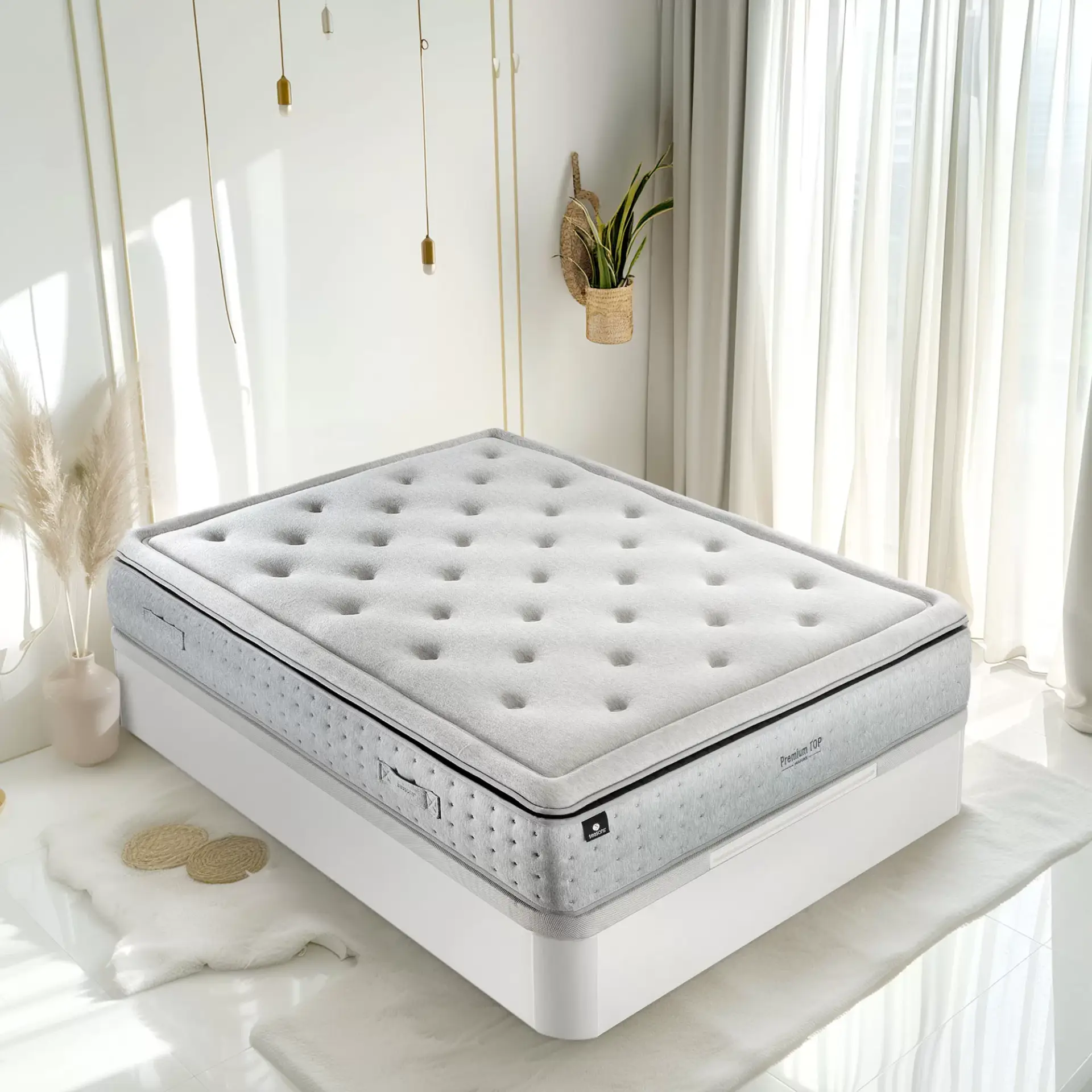 imagen colchón sobre canapé en una habitación en colores blancos